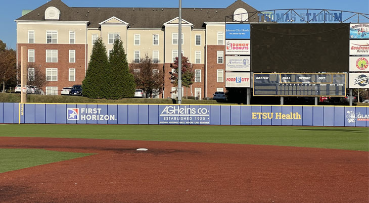 Custom Outfield Wall Pads with Graphics at Thomas Baseball Stadium by Field Wall Pads